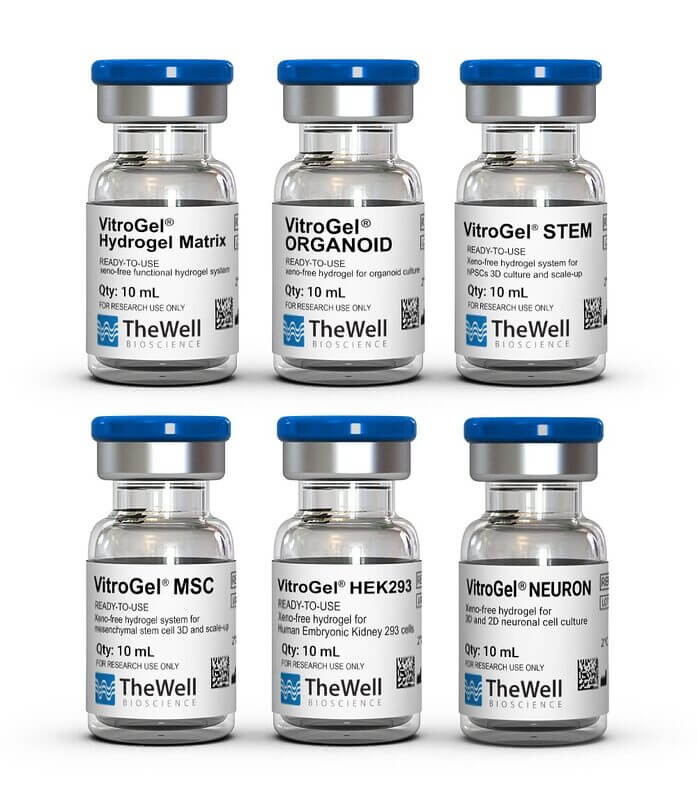 Six small glass vials with blue caps labeled TheWell Bioscience, arranged in two rows of three for research use.